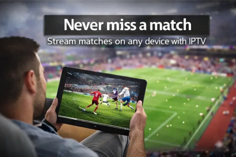 Person watching live football on tablet using IPTV streaming service with stadium match visible on screen